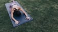 Woman does pigeon pose