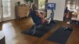 Man does rowing workout at home on Peloton Row