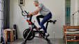 Woman riding a Peloton Bike