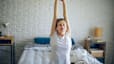 Woman stretching on bed