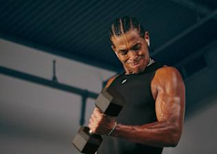 man doing biceps curl