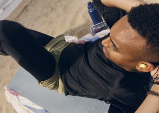 Peloton member working out on the beach sweating