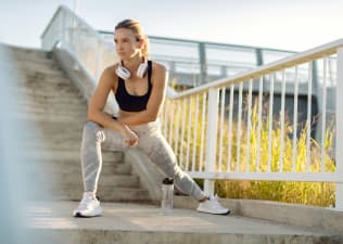 Woman stretches outdoors