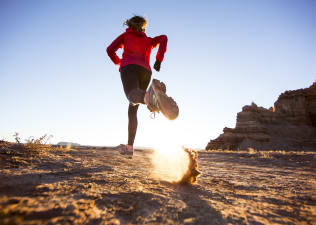 Woman trail running outdoors