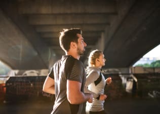 man and woman running side by side