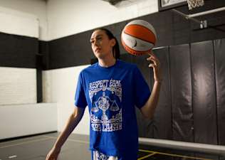 WNBA All-Star Breanna Stewart spinning a basketball on her finger on an indoor basketball court
