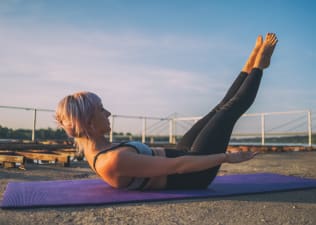 Woman doing Pilates Hundred Move