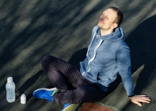 Man meditating on the ground