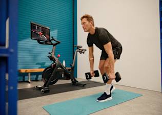 Man doing a Peloton Bike Bootcamp class as part of his weekly workout routine.