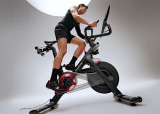 Man doing an FTP cycling test on a Peloton bike.