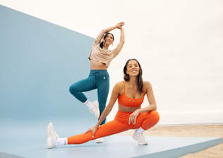 Hannah Corbin and Katie Wang wearing the Peloton Apparel x TravisMathew collection