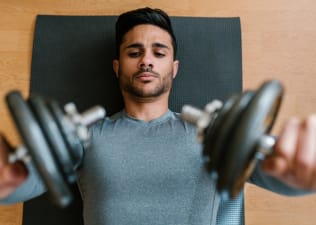 Man lifting two dumbbells