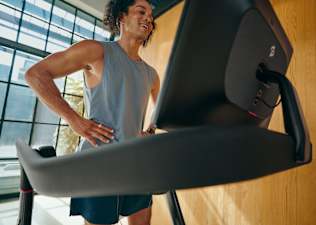 Man running on Peloton treadmill