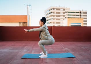 Woman does squat variations outside