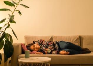 Woman resting on couch