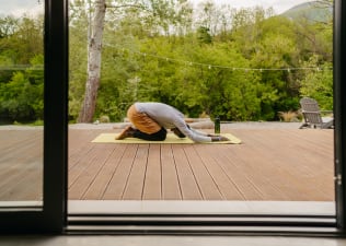 Man does Child's Pose, yoga for relaxation