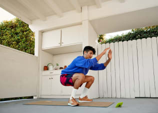 Person squatting during warm-up