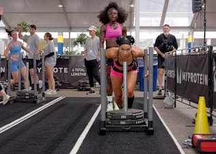 Peloton instructors Robin Arzón and Tunde Oyeneyin competing in HYROX.