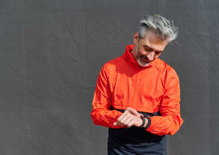 man in orange running jacket