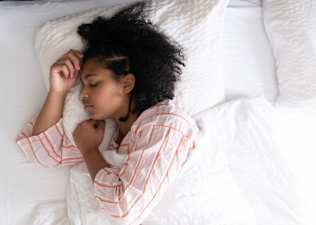 Young woman in bed