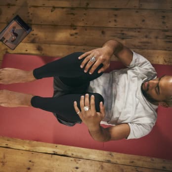 man doing mat pilates class