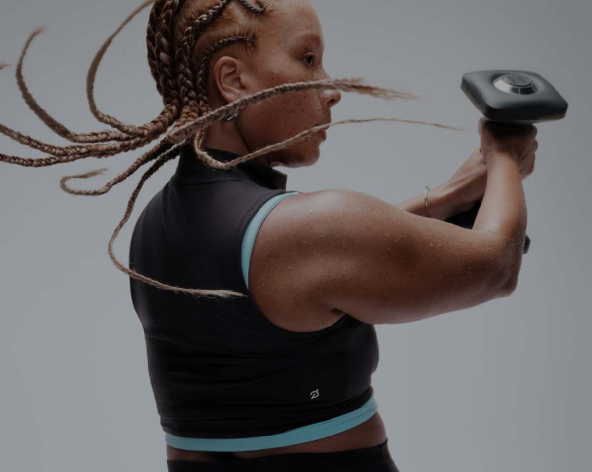 Woman working out using Peloton App