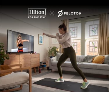 woman taking peloton app boxing class