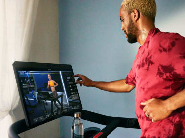 Man adjusting Peloton Tread touchscreen