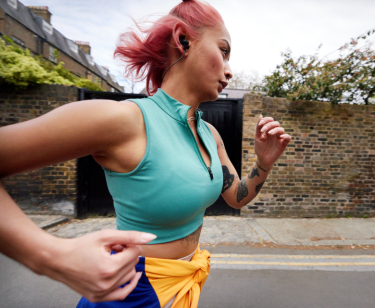 member using peloton app outdoors