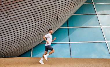 Man running near building