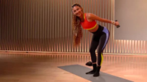 Ally Love using arm weights