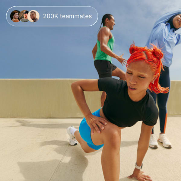 Woman kneeling down preparing to run 