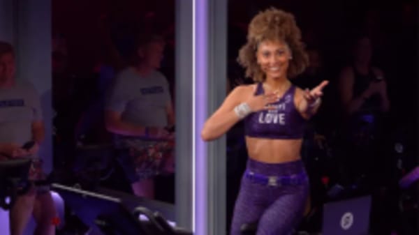 Ally Love doing workout on Peloton Bike