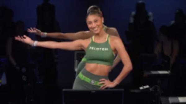 Ally Love doing workout on Peloton Bike