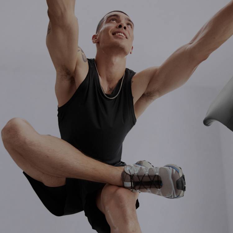 Man exercising using Peloton equipment