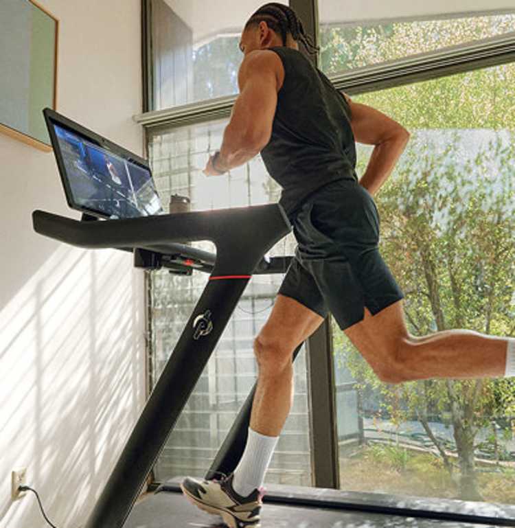 A man running on a Peloton Tread