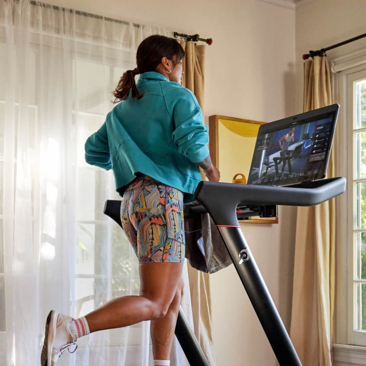 Woman running on Peloton Tread