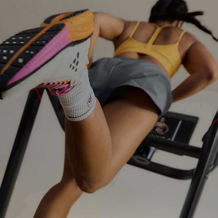 Woman running on Peloton Tread