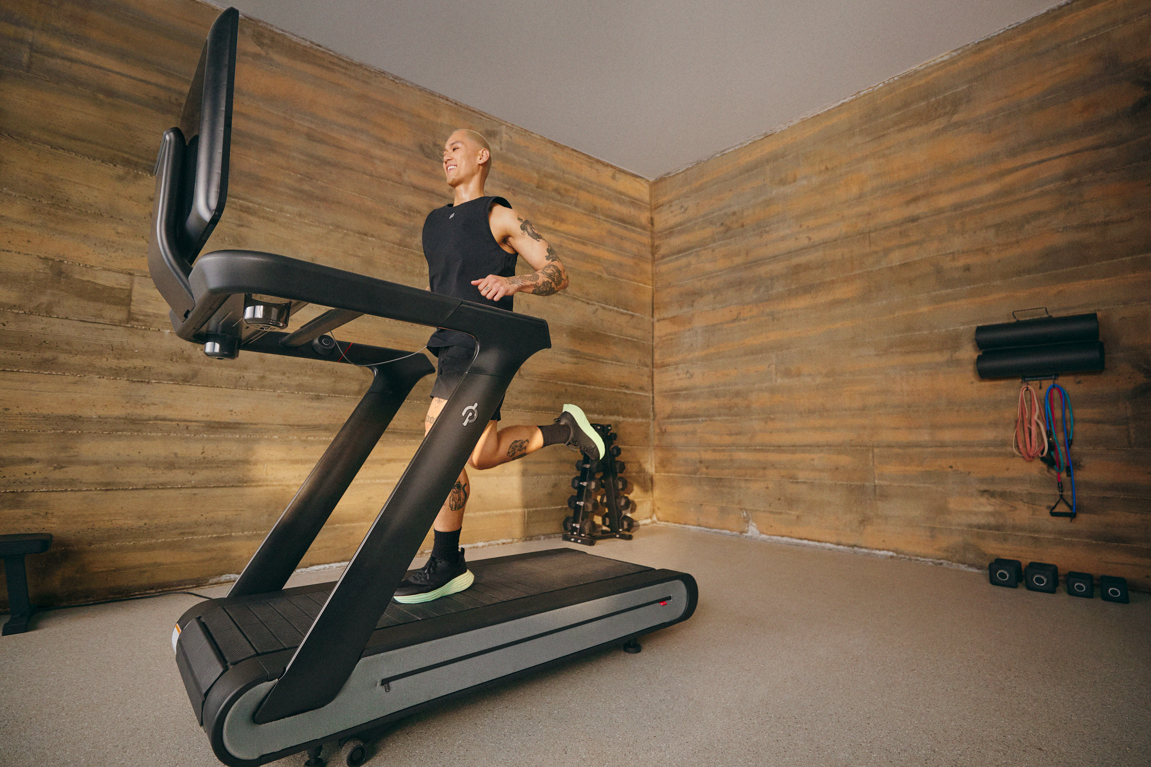 Man running on a Peloton Tread+ wondering about the differences between running on a treadmill vs outside.