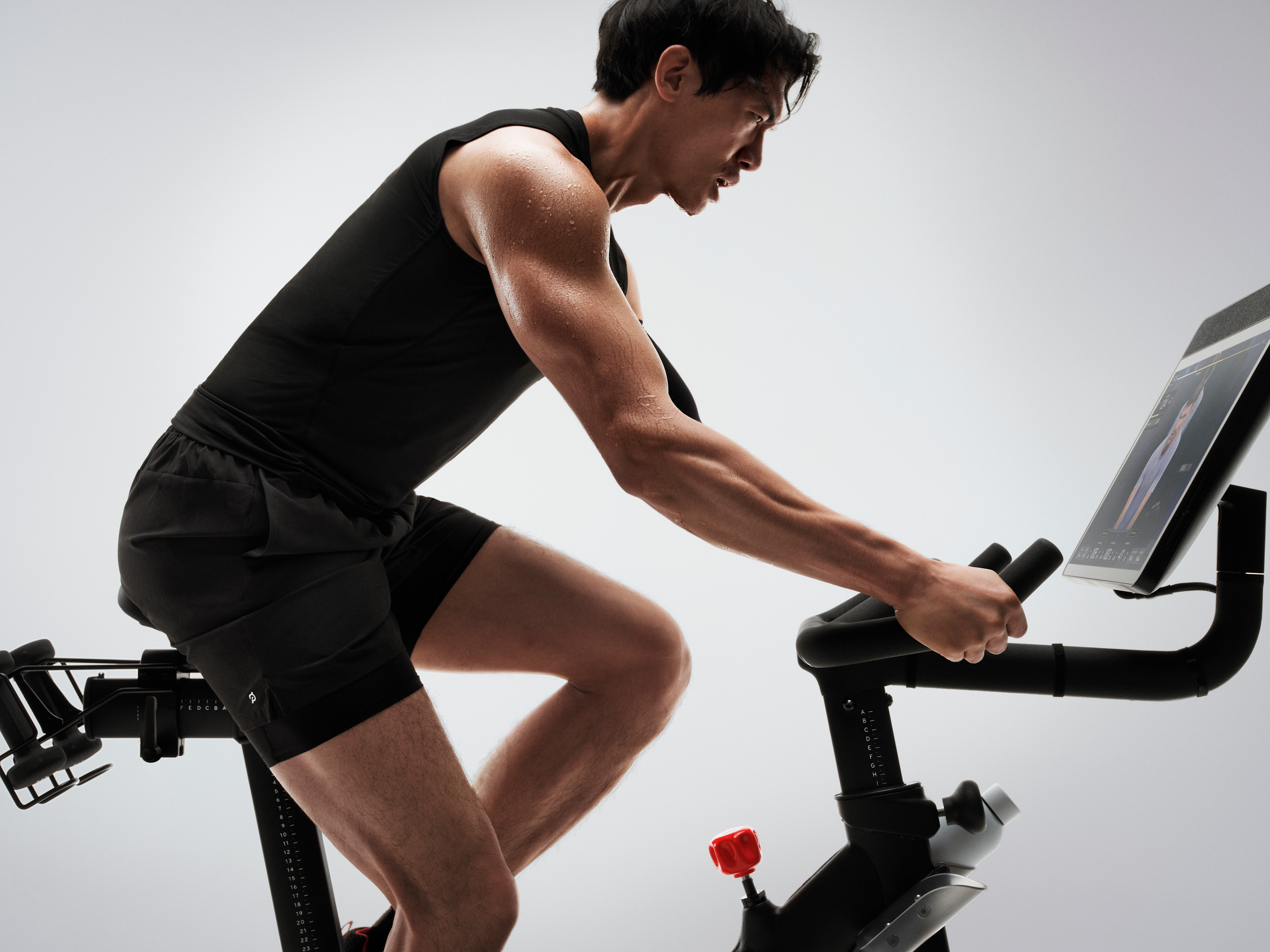 Man doing a functional threshold power test on a Peloton bike.