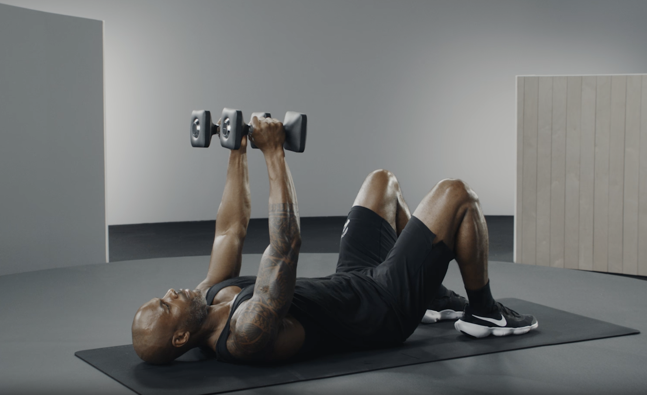 Adrian Williams demonstrates a skull crusher exercise 