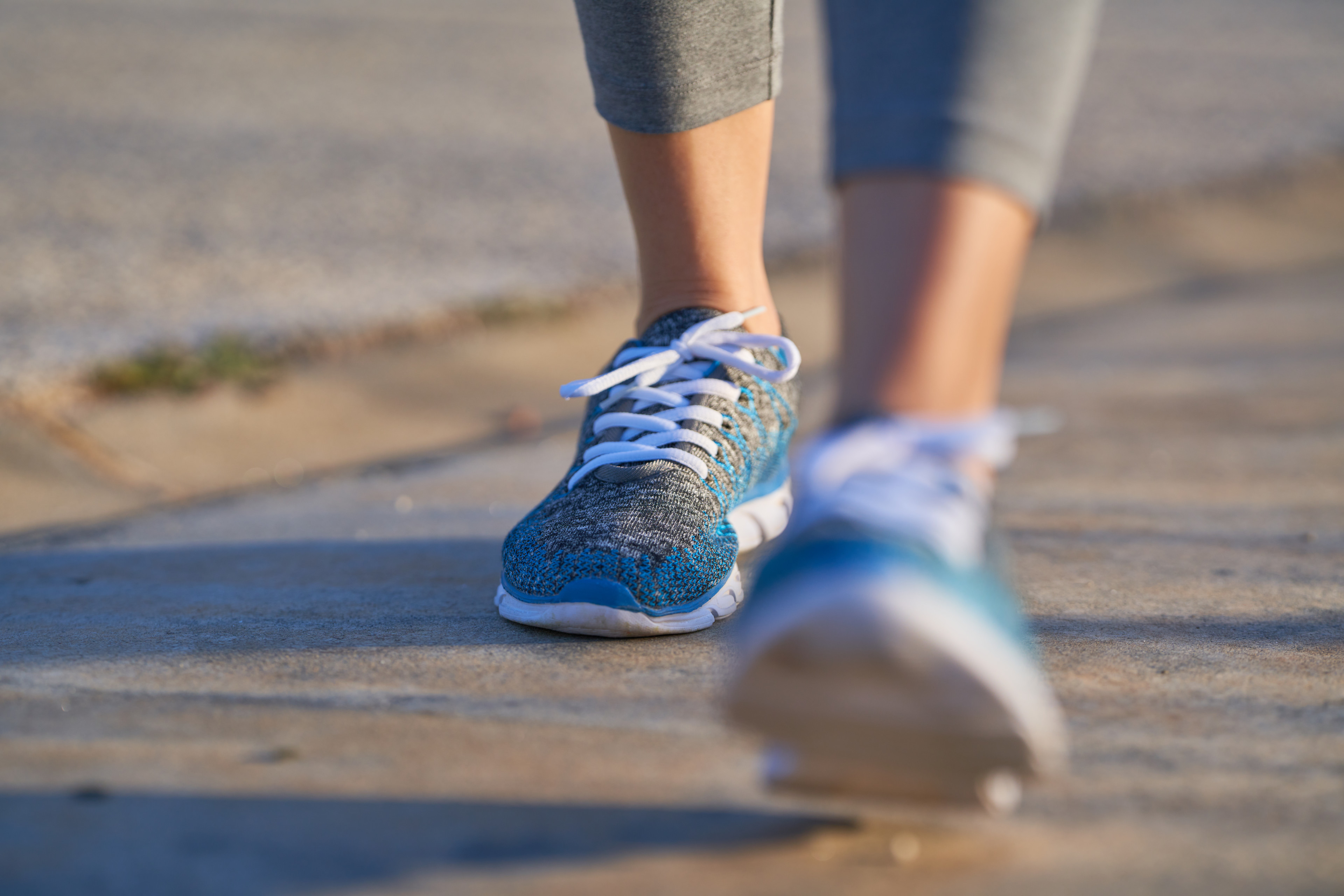 Closeup shot of sneakers walking