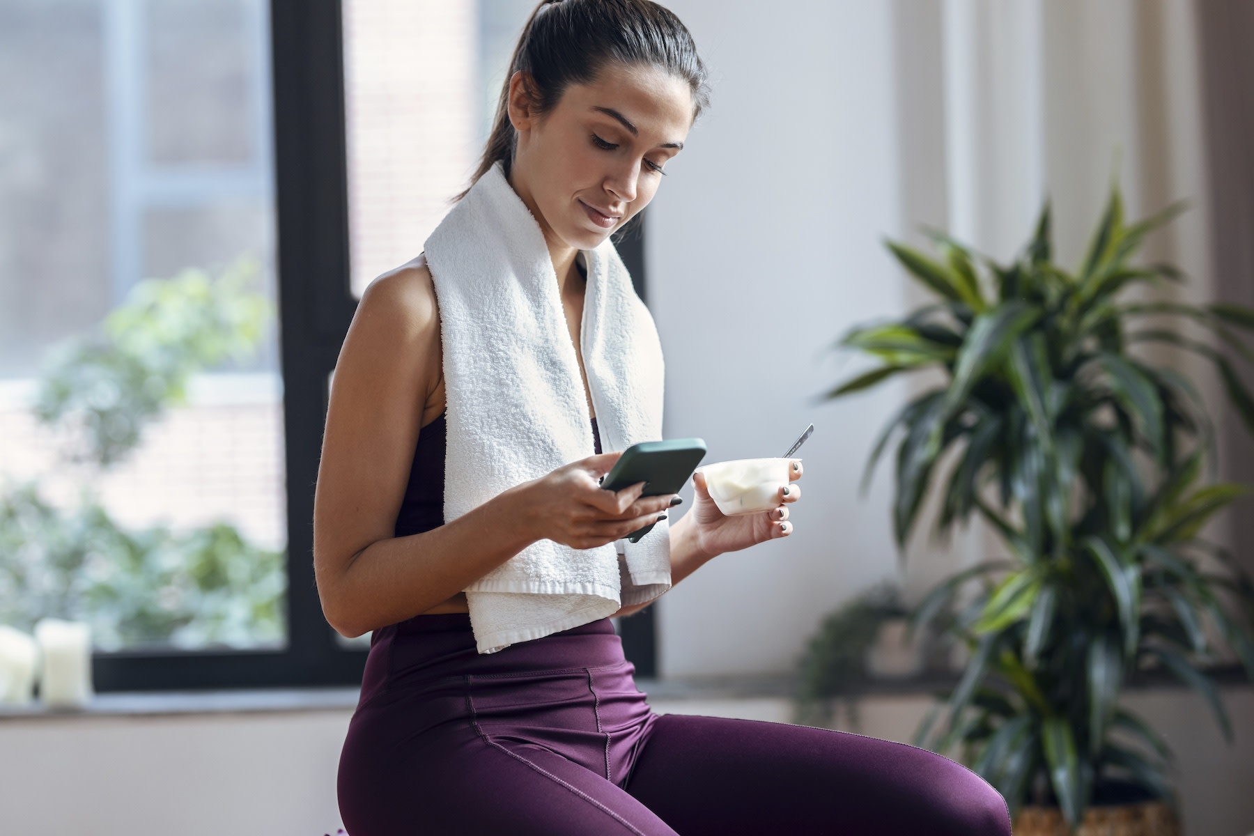 woman eating a snack after a workout