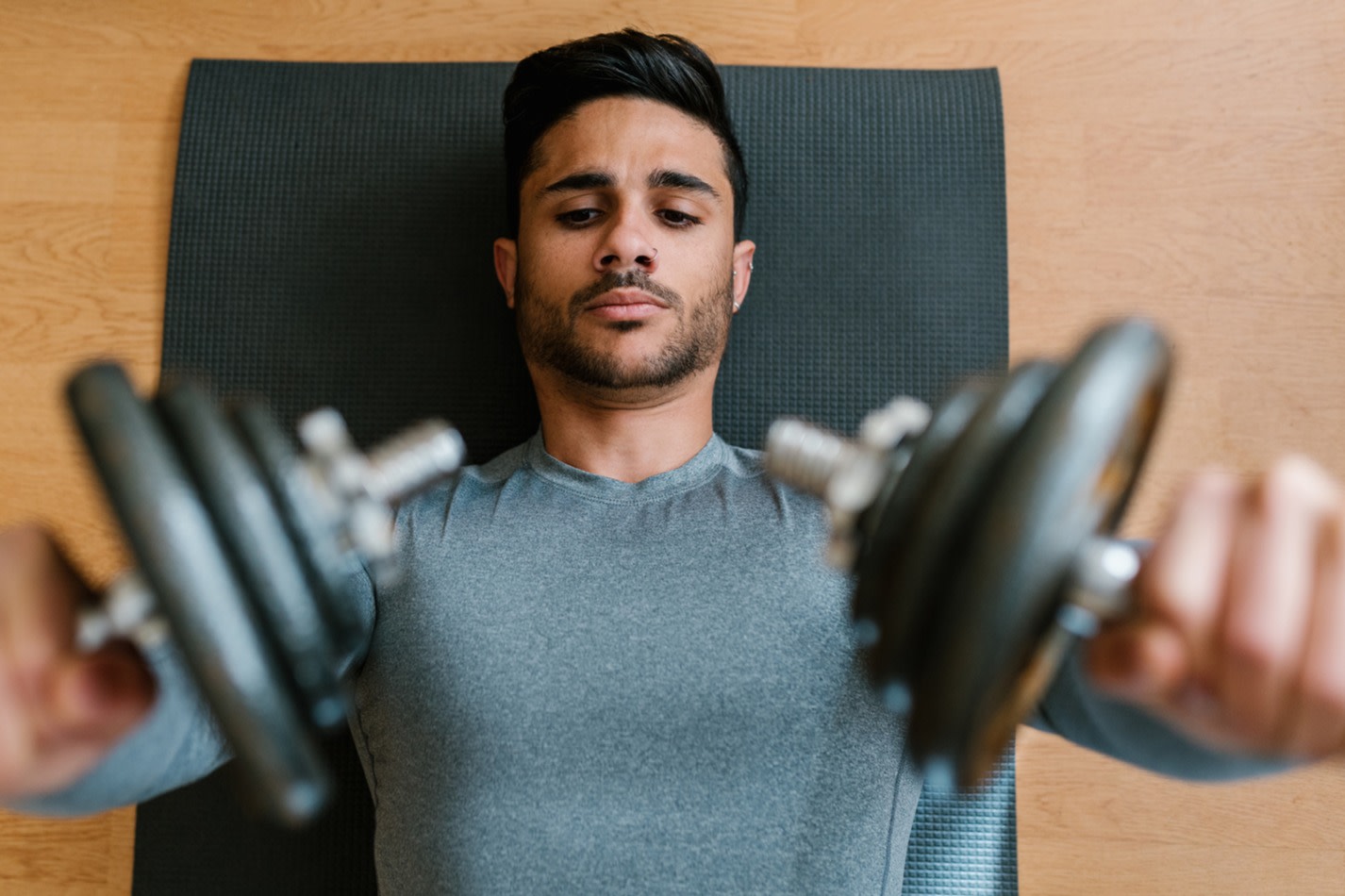 Man lifting two dumbbells