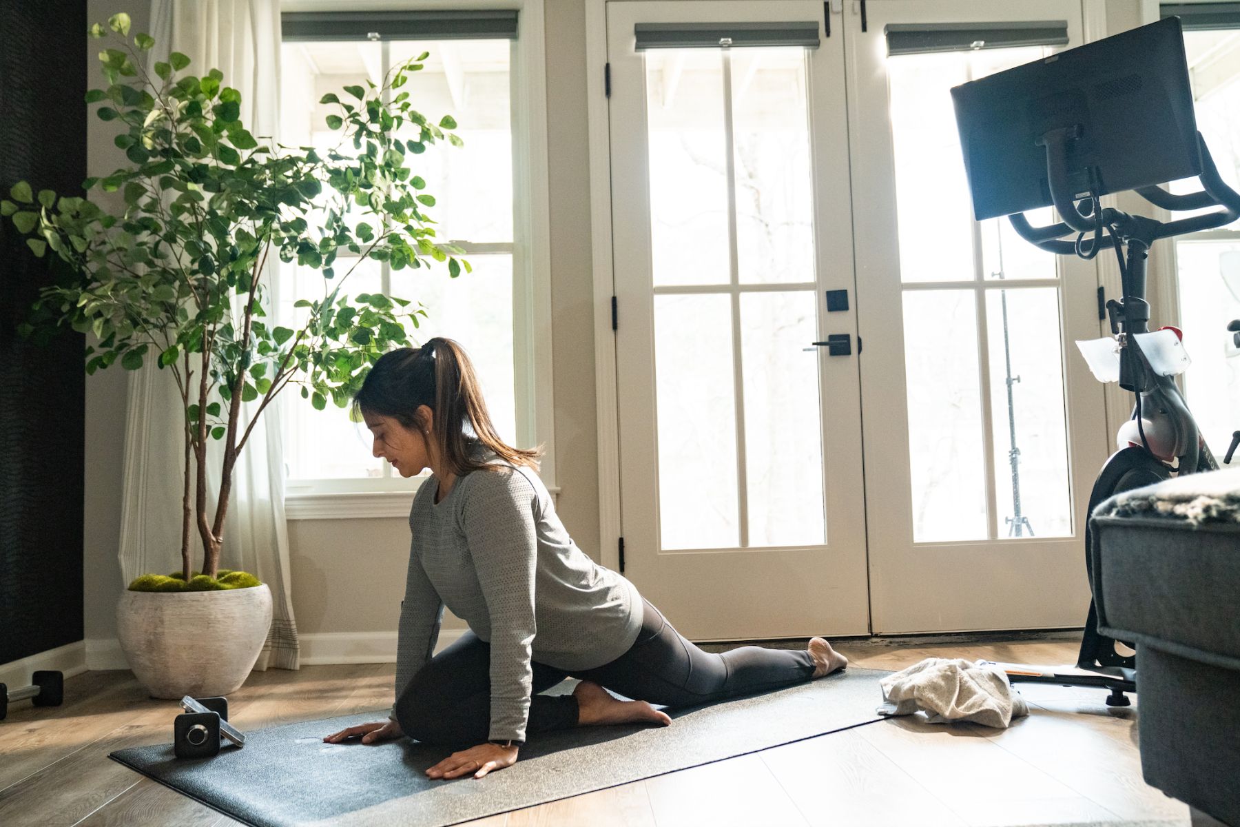 Woman doing yoga inside