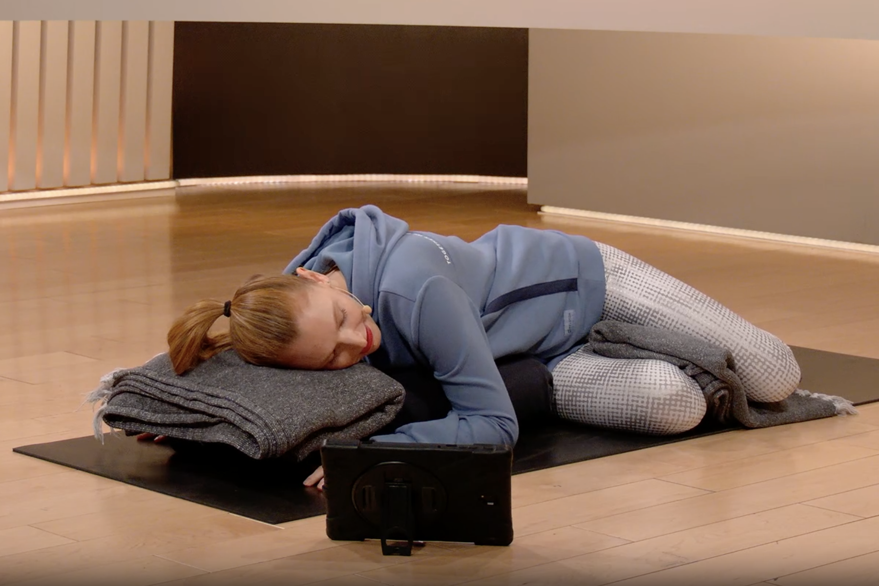 Woman does a restorative yoga pose