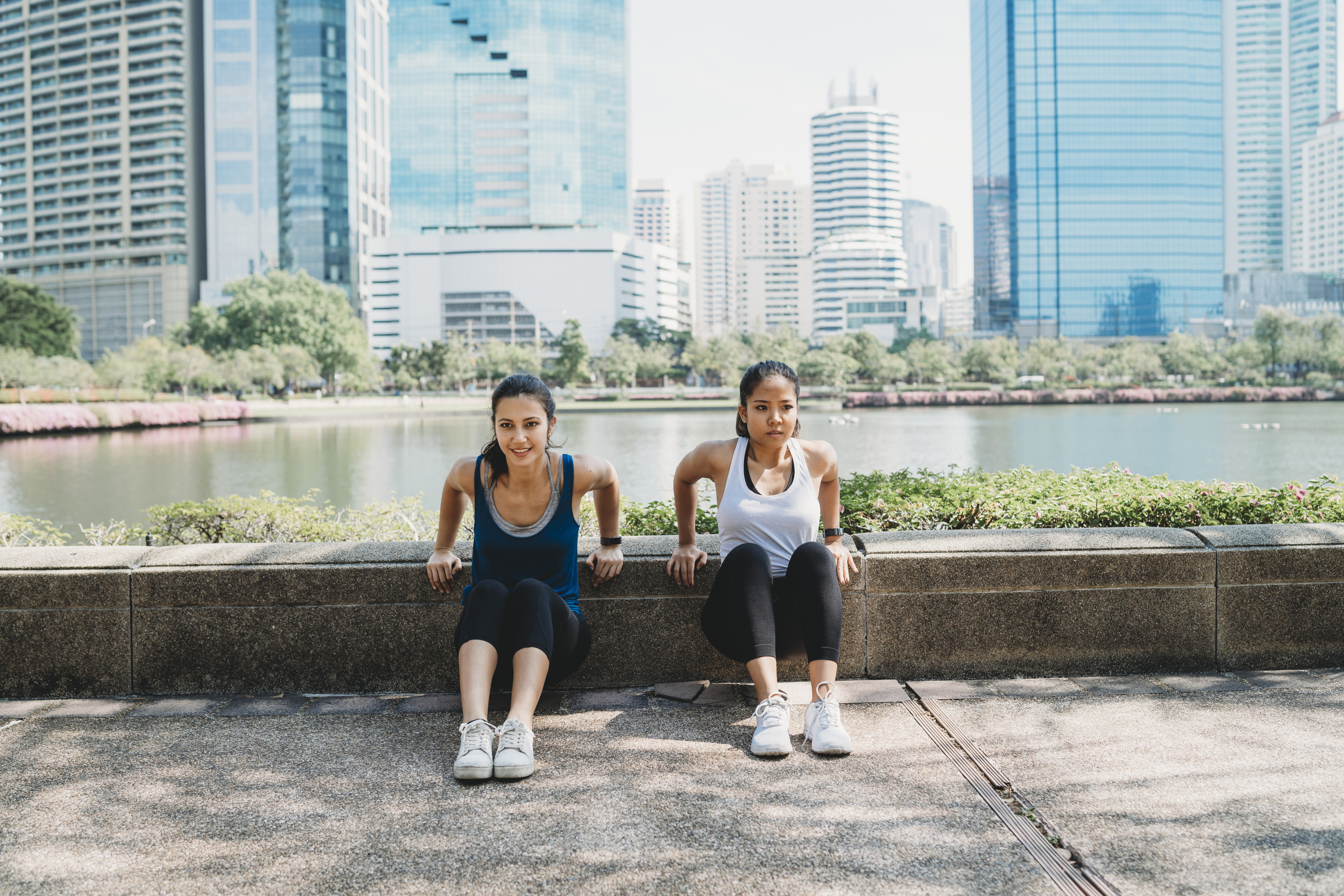 Two women exercise outdoors