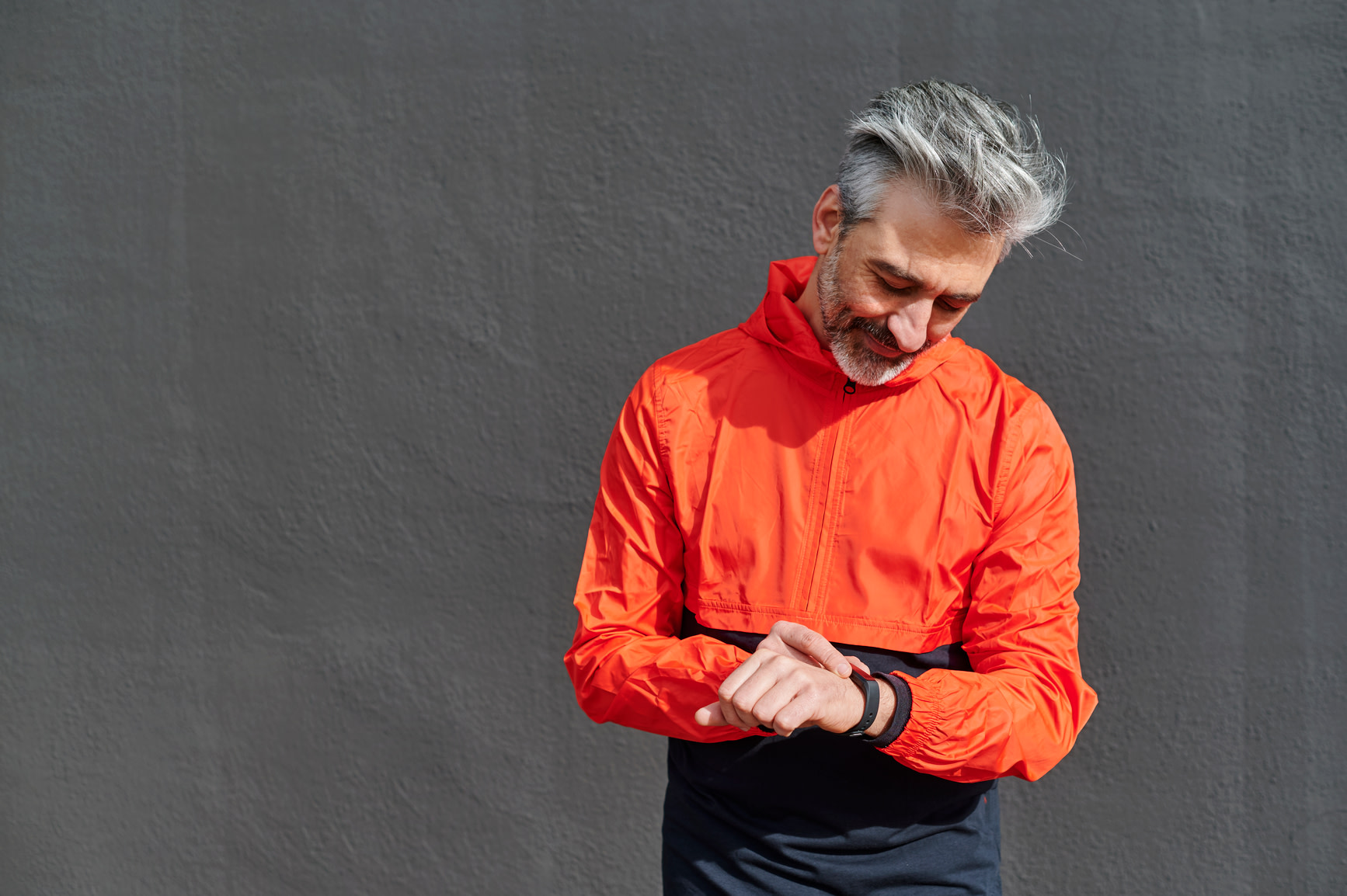 man in orange running jacket