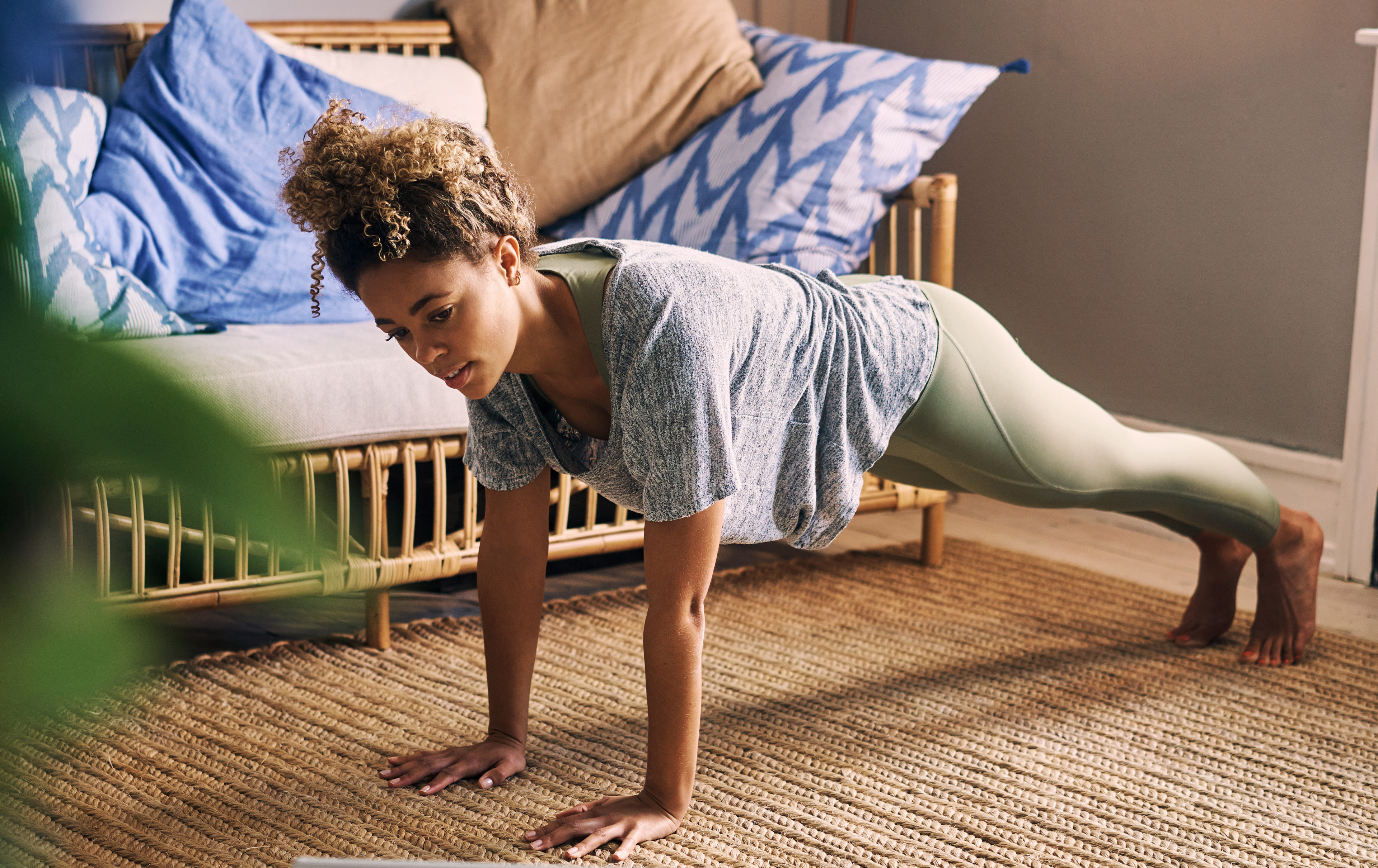 Woman does the inchworm exercise