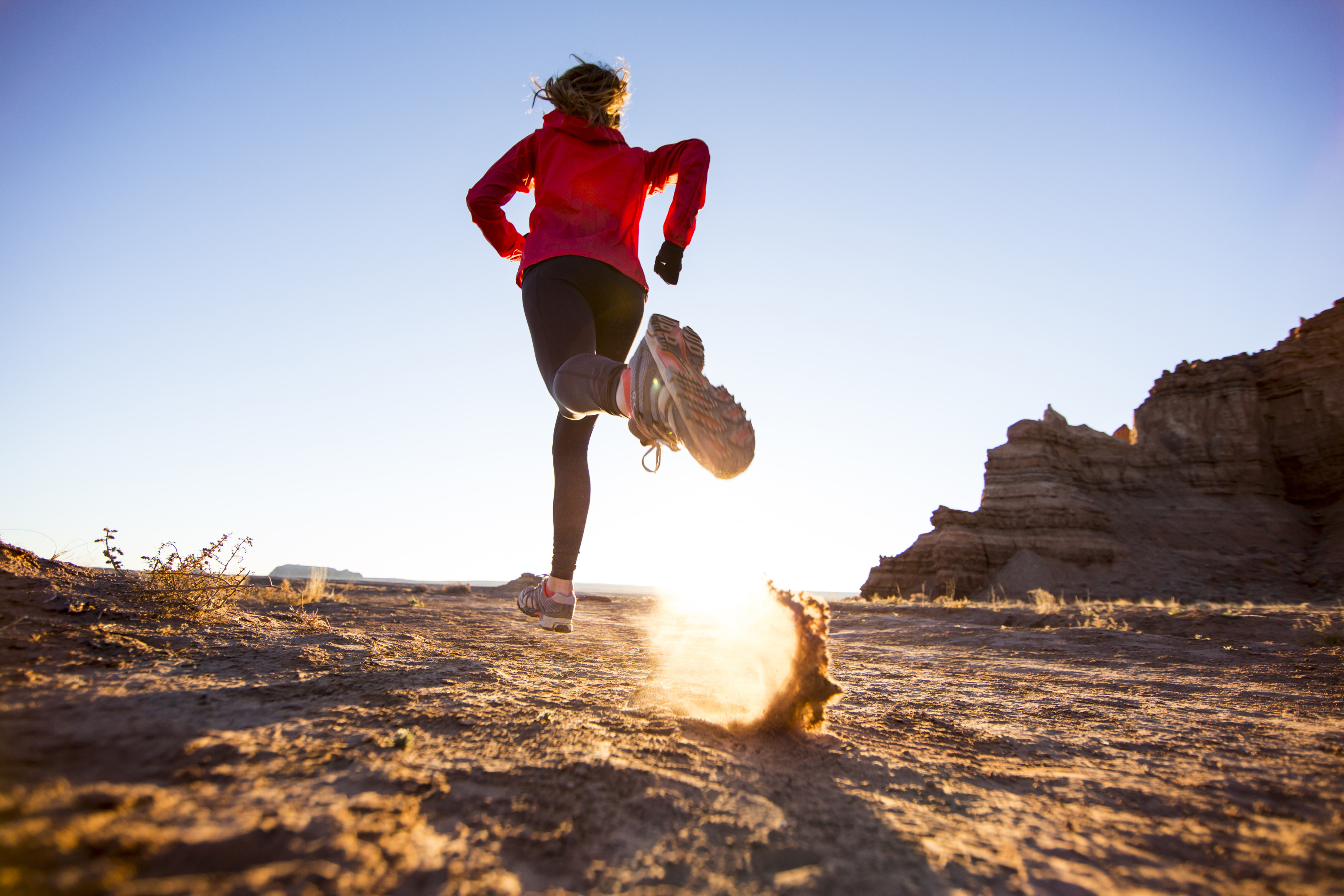 Woman trail running outdoors